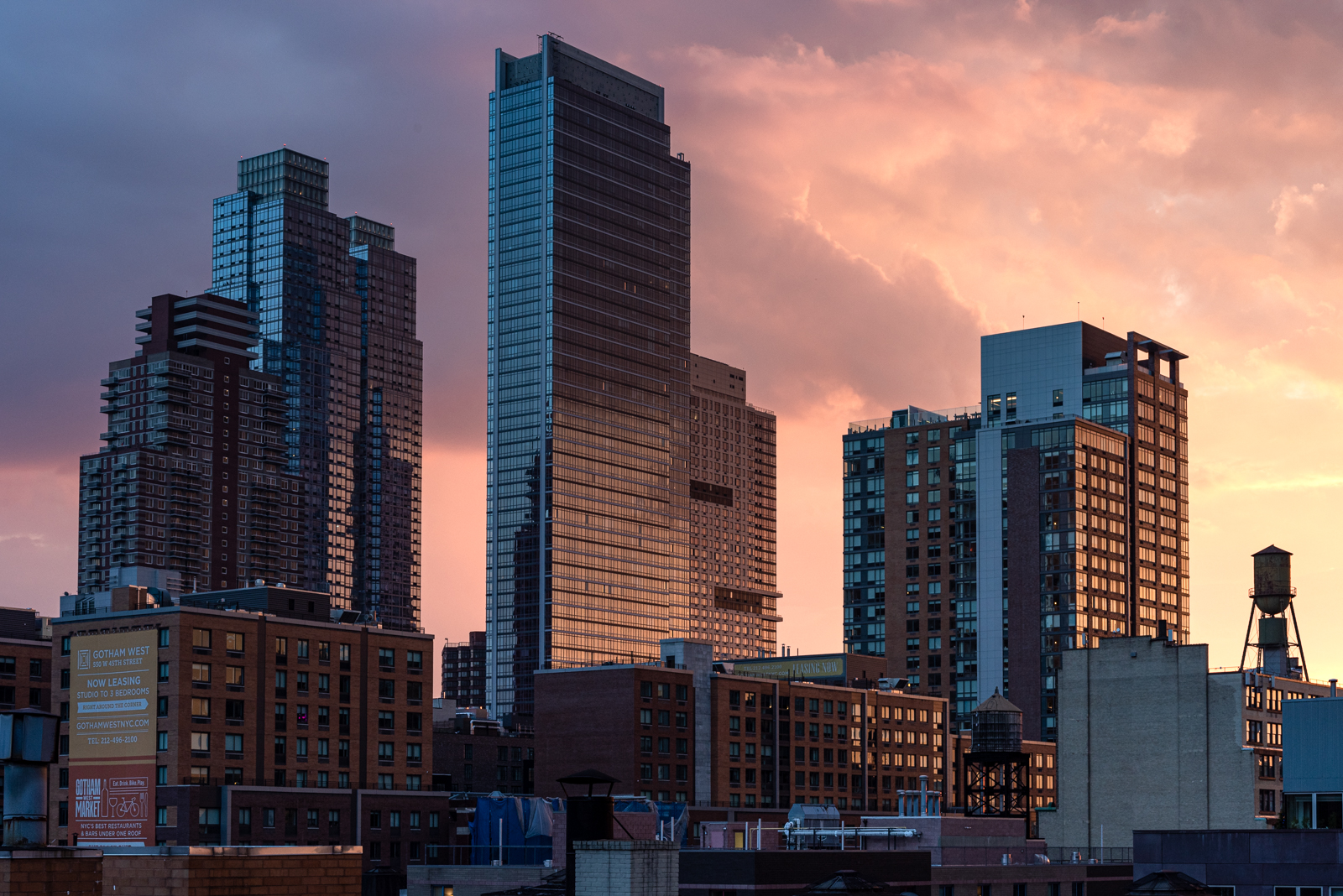 new york city, sunset, west side, water towers, residential buildings, rooftops.